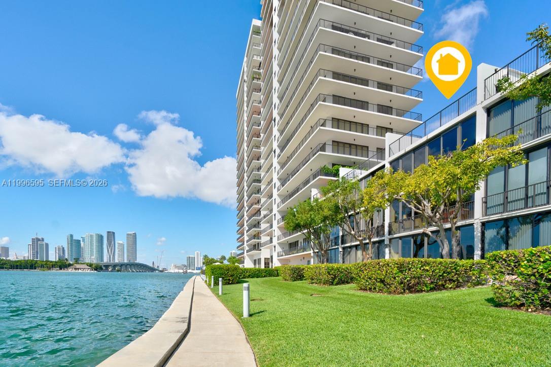 1000 Venetian Way, Unit 105 Miami, FL 33139 - Photo 1 of 49 a view of a building with a swimming pool