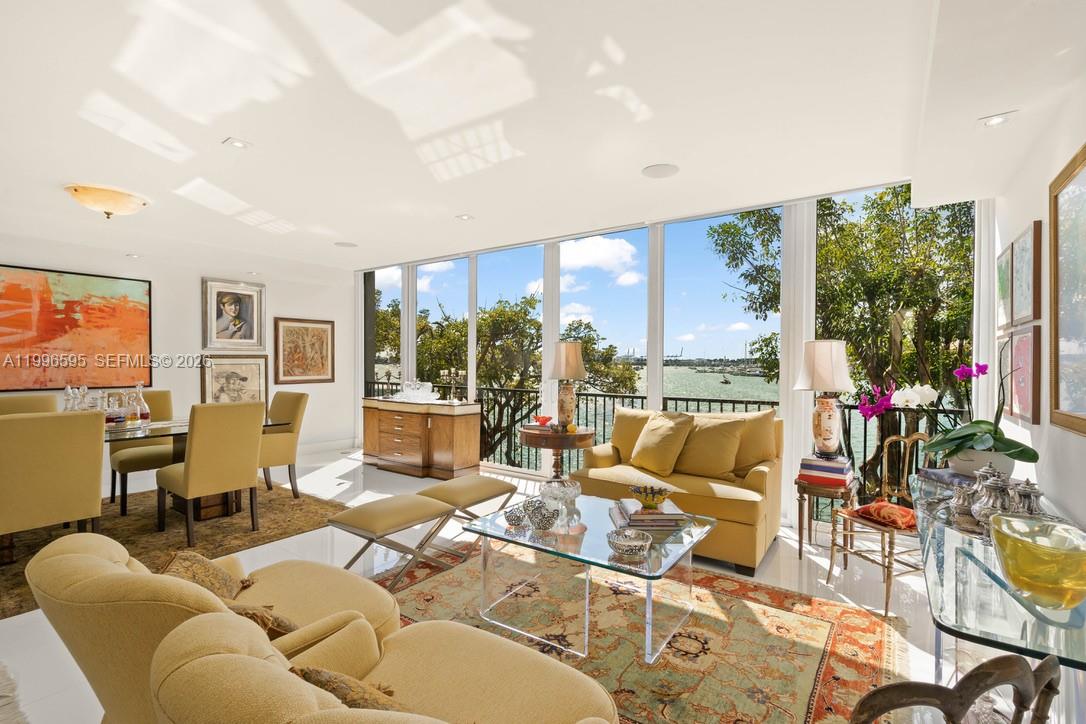 1000 Venetian Way, Unit 105 Miami, FL 33139 - Photo 15 of 49 a living room with furniture and a floor to ceiling window
