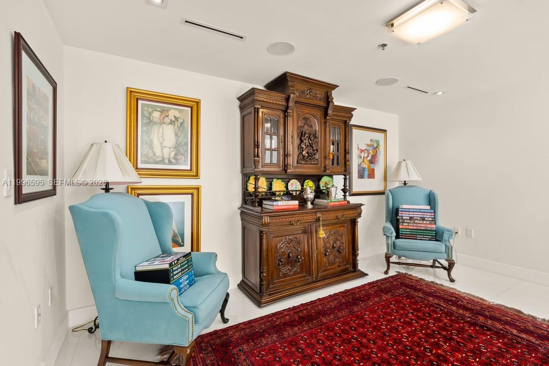 1000 Venetian Way, Unit 105 Miami, FL 33139 - Photo 25 of 49 a living room with furniture and a fireplace