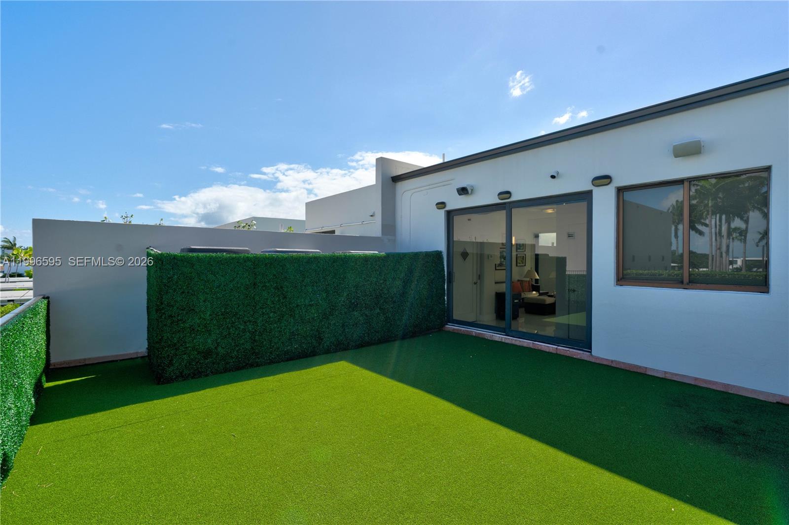 1000 Venetian Way, Unit 105 Miami, FL 33139 - Photo 34 of 49 a view of a backyard of the house