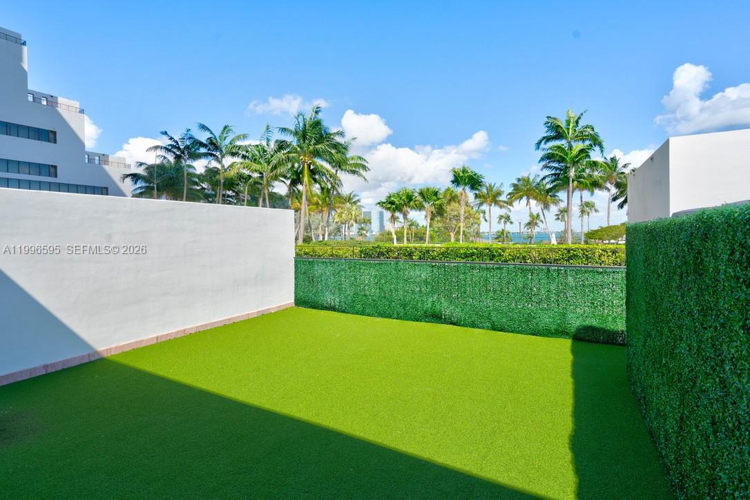 1000 Venetian Way, Unit 105 Miami, FL 33139 - Photo 39 of 49 a view of a yard with a fountain