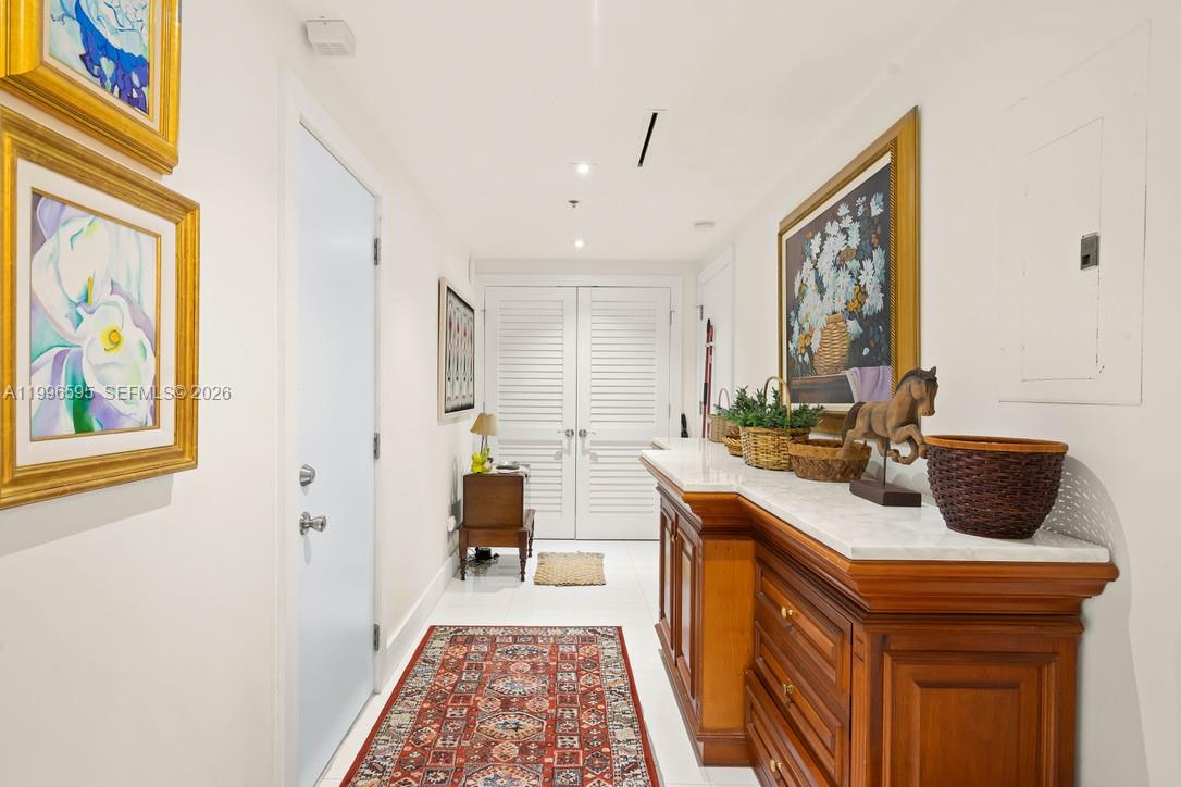 1000 Venetian Way, Unit 105 Miami, FL 33139 - Photo 43 of 49 a hallway with a sink and a microwave