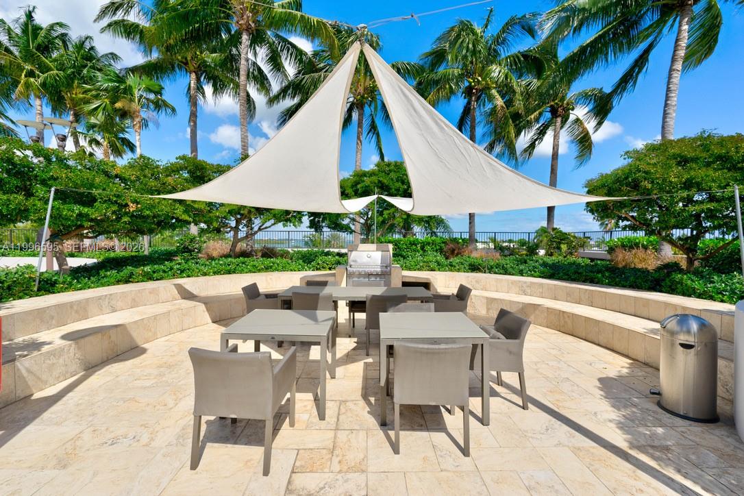 1000 Venetian Way, Unit 105 Miami, FL 33139 - Photo 44 of 49 a view of backyard of house with seating space