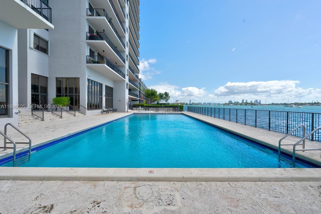 1000 Venetian Way, Unit 105 Miami, FL 33139 - Photo 45 of 49 a view of an swimming pool with outdoor seating