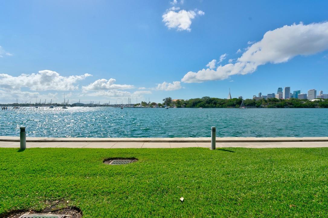 1000 Venetian Way, Unit 105 Miami, FL 33139 - Photo 8 of 49 a view of a lake with a yard