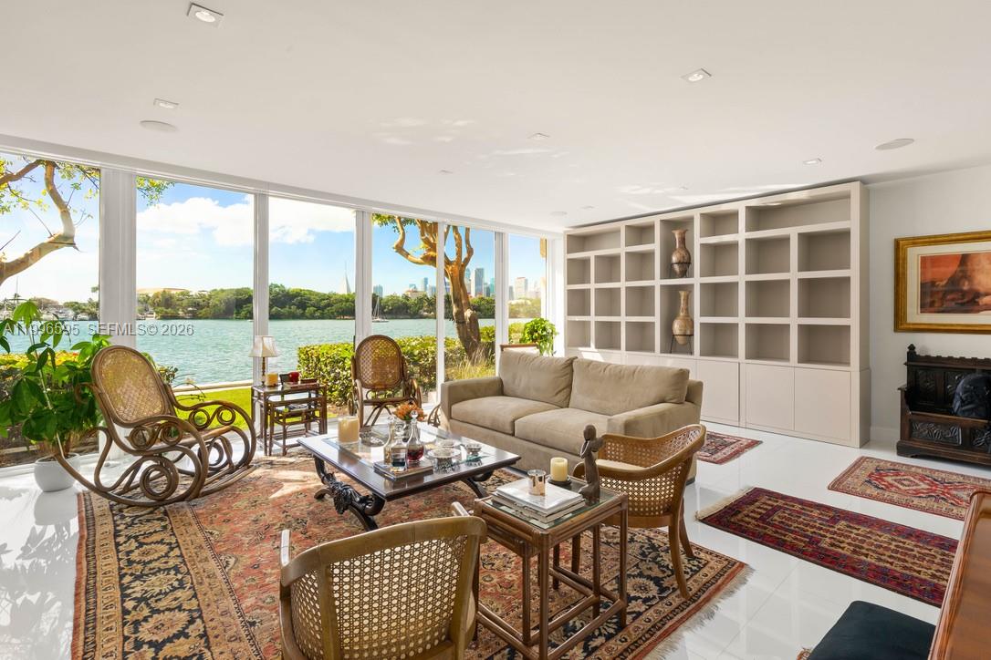 1000 Venetian Way, Unit 105 Miami, FL 33139 - Photo 10 of 49 a living room with furniture and a large window
