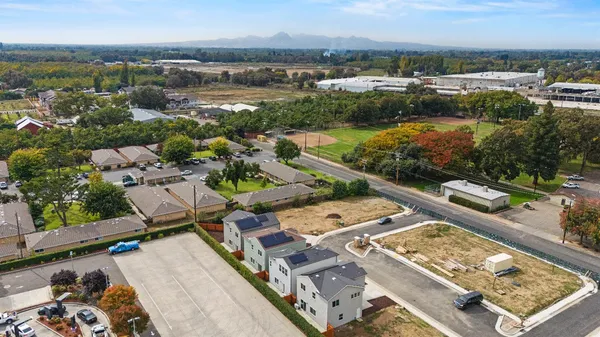 a view of a house with car parked