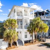 a view of a building with palm trees
