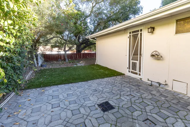 a backyard of a house with lots of green space