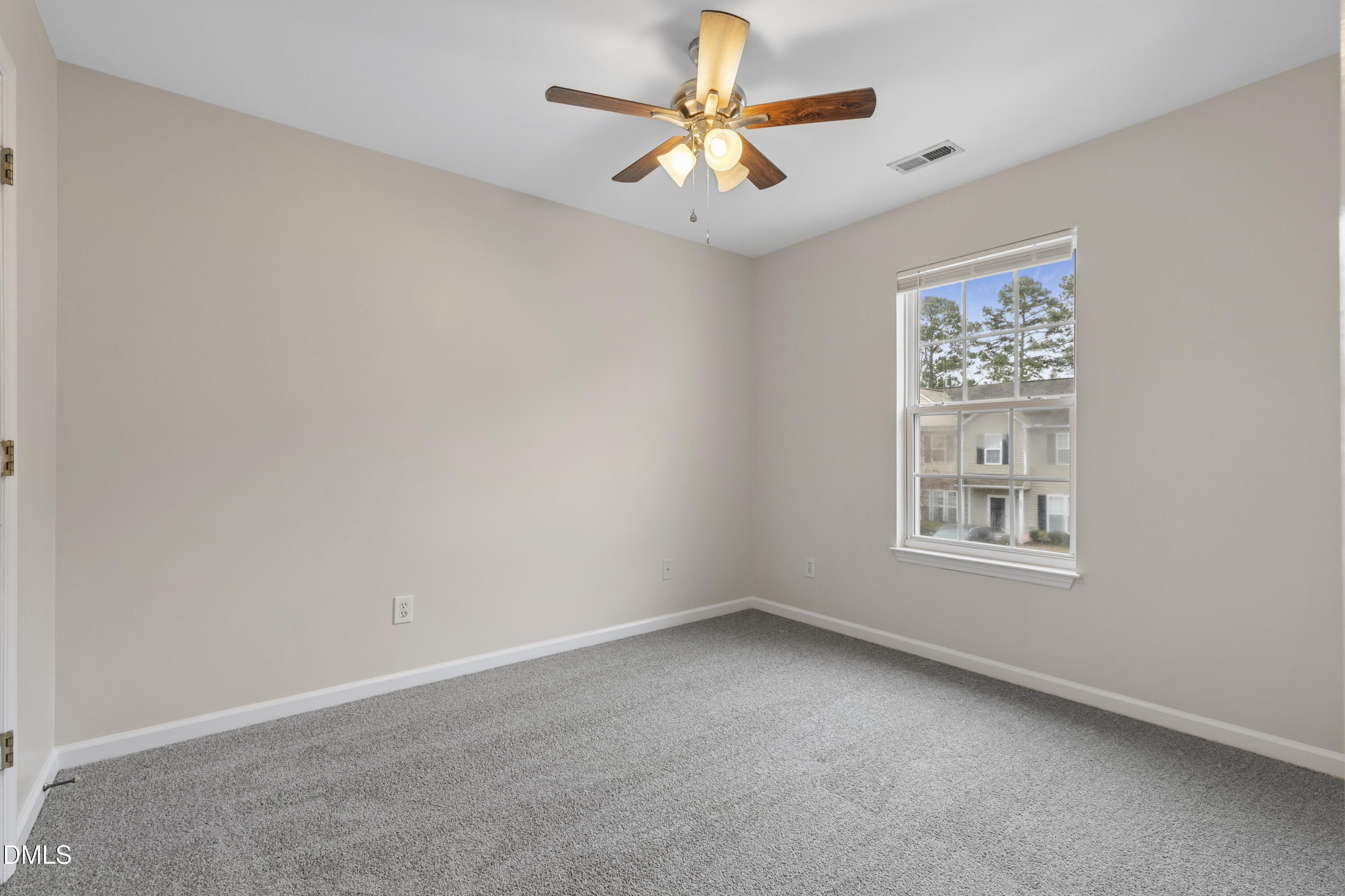 6013 San Marcos Way Raleigh, NC 27616 - Photo 16 of 21 an empty room with a window and a fan