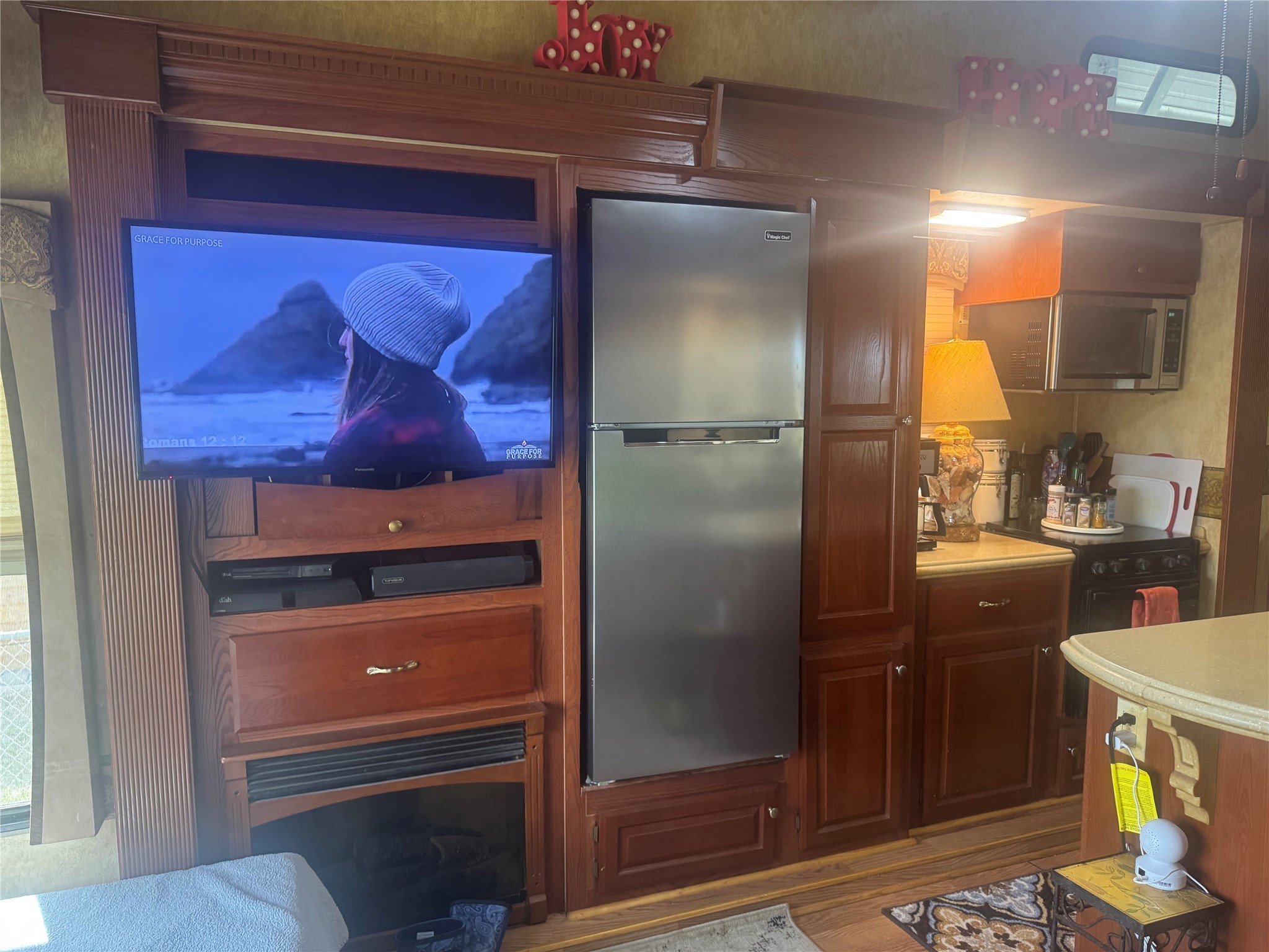 1561 County Road 299 Sargent, TX 77414 - Photo 11 of 26 a kitchen with a refrigerator and cabinets