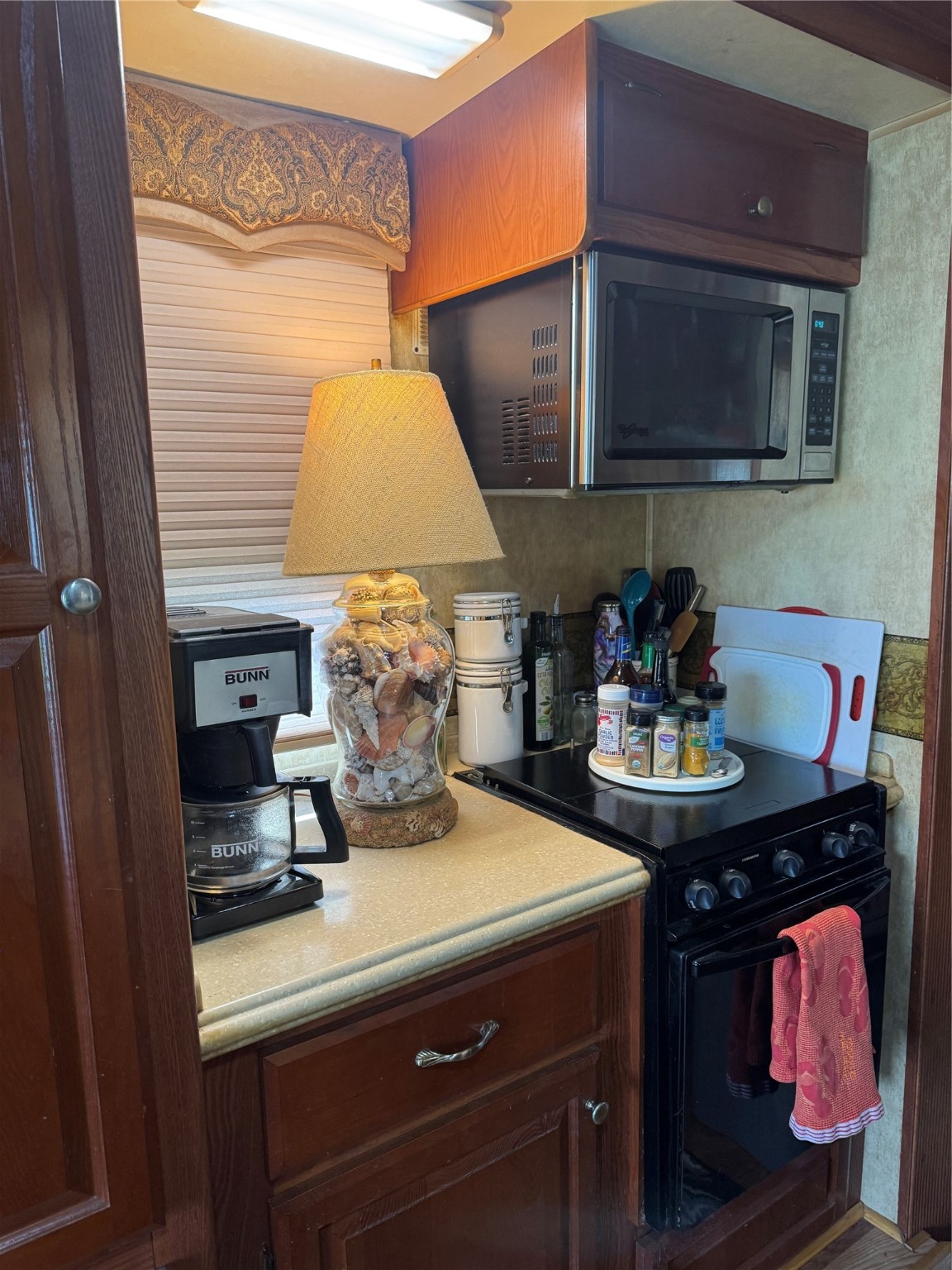 1561 County Road 299 Sargent, TX 77414 - Photo 12 of 26 a kitchen with a sink and cabinets