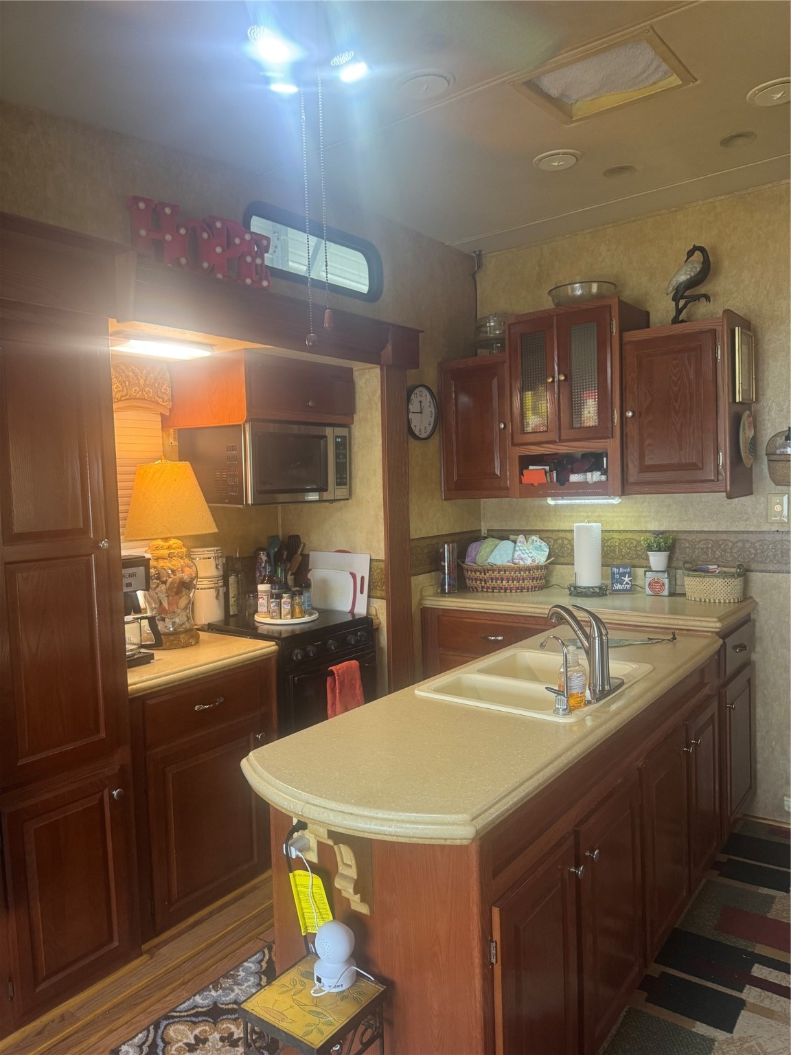 1561 County Road 299 Sargent, TX 77414 - Photo 15 of 26 a kitchen with counter top space cabinets and stainless steel appliances