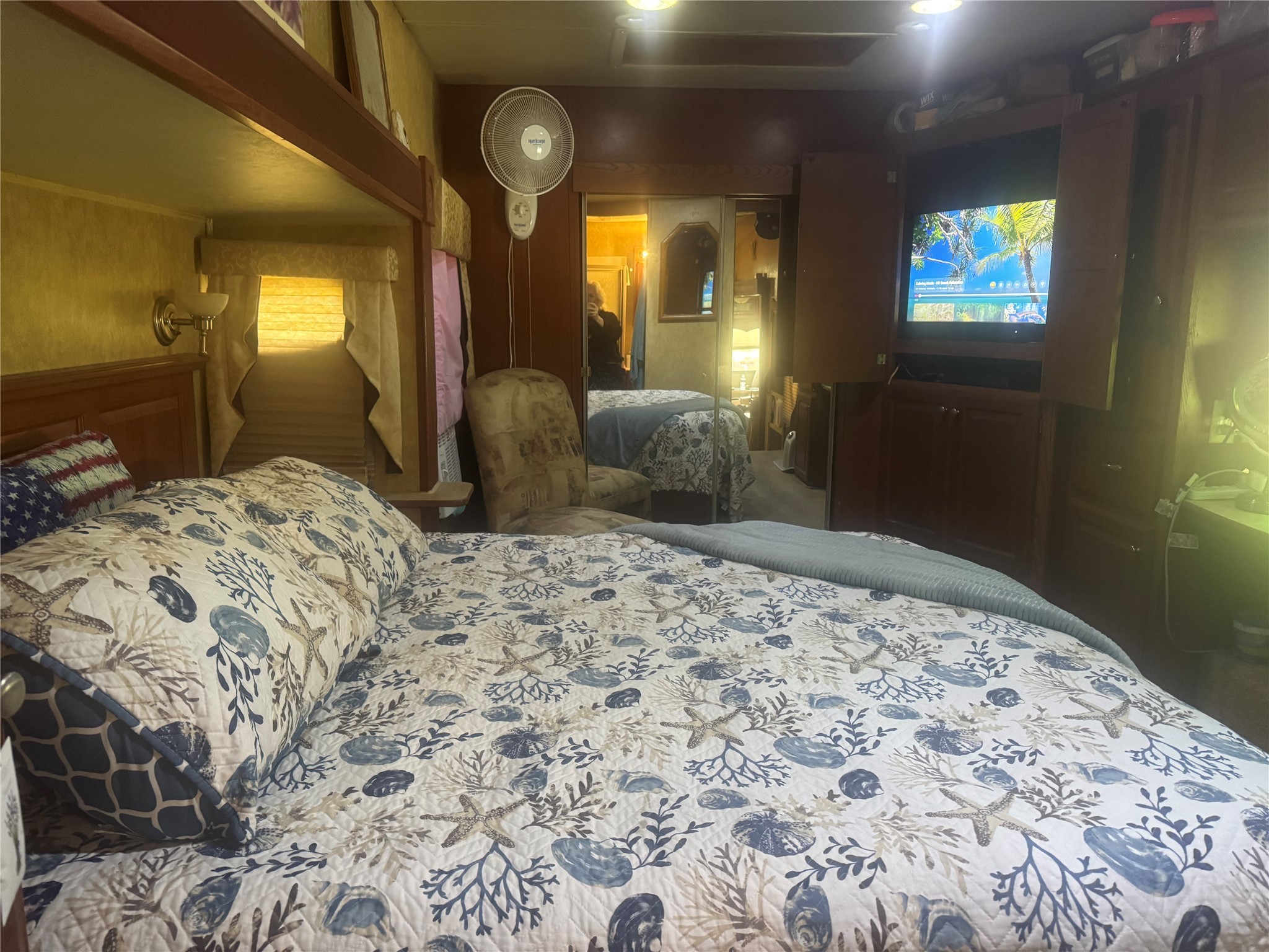 1561 County Road 299 Sargent, TX 77414 - Photo 19 of 26 a bedroom with a bed and a mirror on dresser