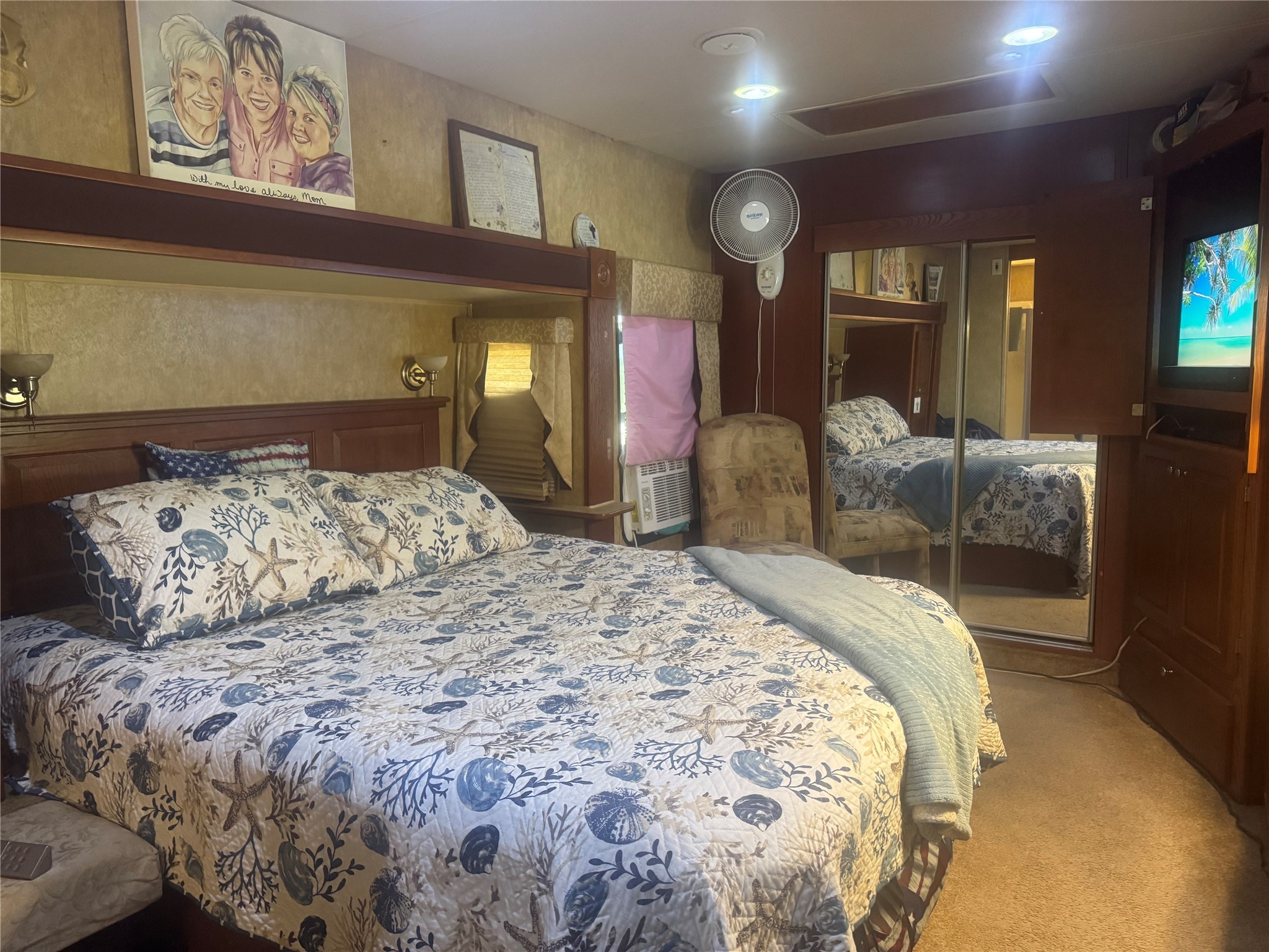 1561 County Road 299 Sargent, TX 77414 - Photo 20 of 26 a bedroom with a large bed and a tv