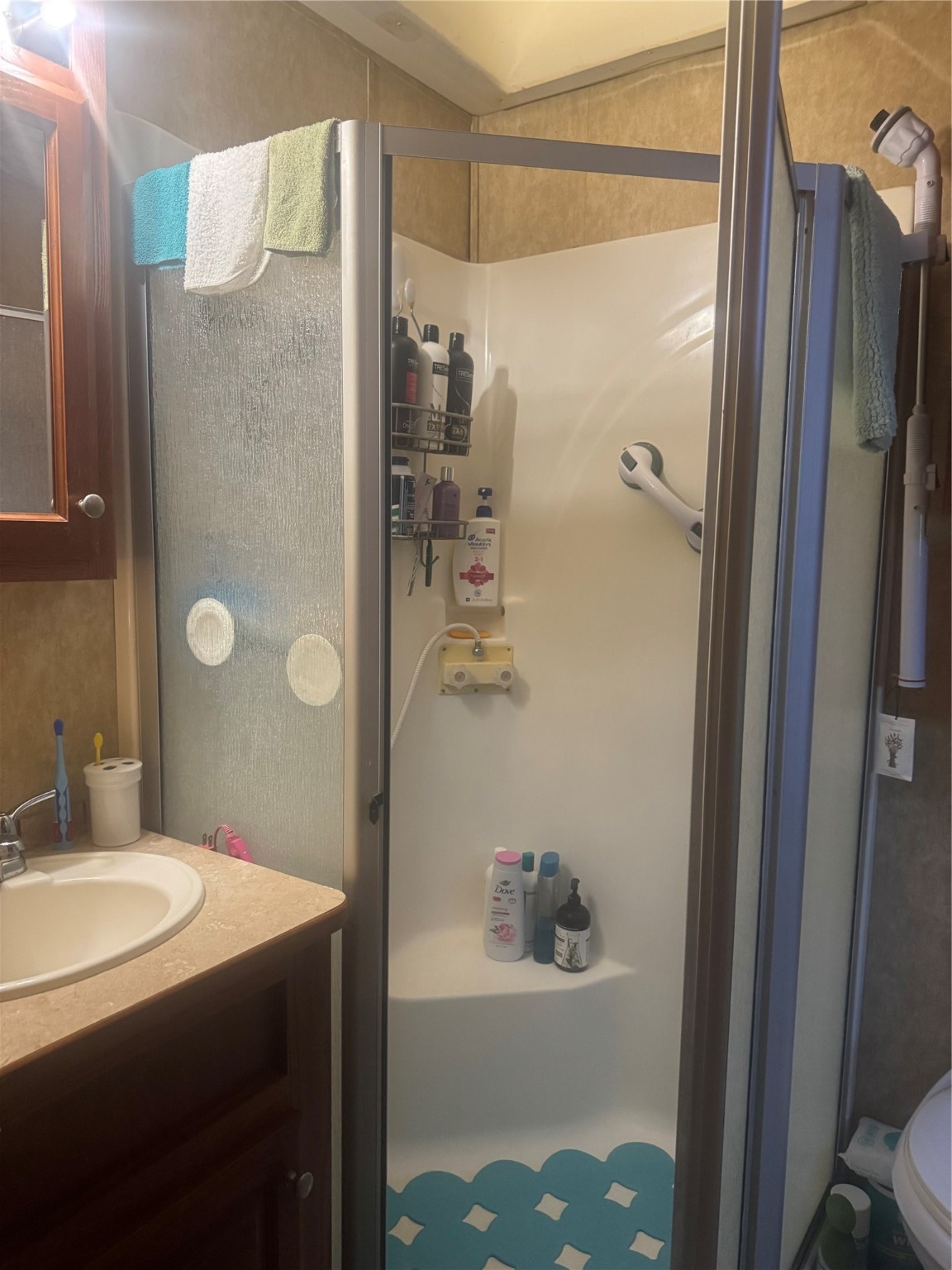 1561 County Road 299 Sargent, TX 77414 - Photo 22 of 26 a bathroom with a sink toilet and shower