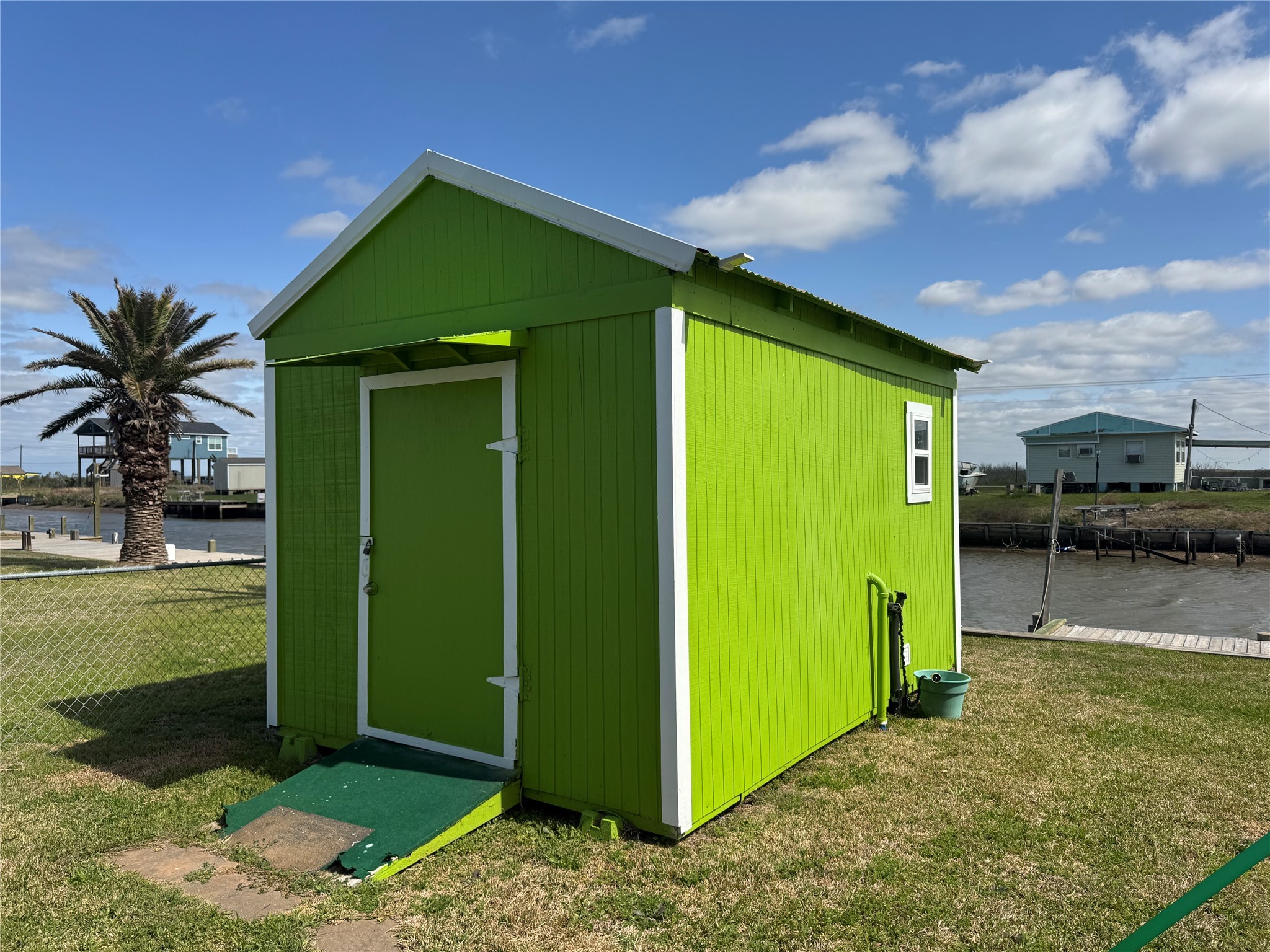 1561 County Road 299 Sargent, TX 77414 - Photo 3 of 26 a green field with small trees in front of it