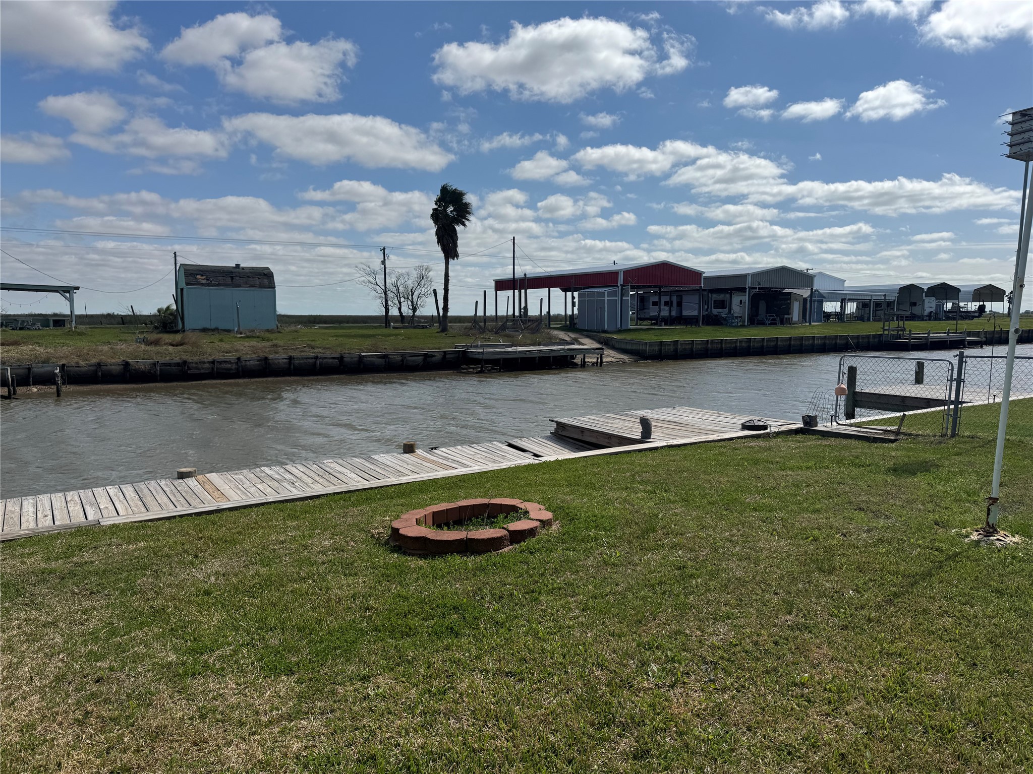 1561 County Road 299 Sargent, TX 77414 - Photo 6 of 26 a view of a lake with houses in back