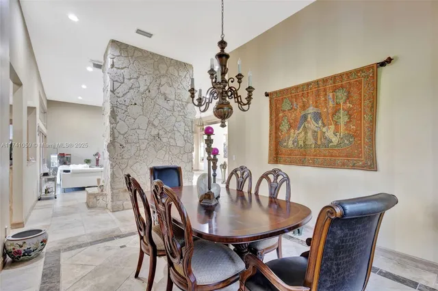 a kitchen with a stove a faucet cabinets and a counter top space