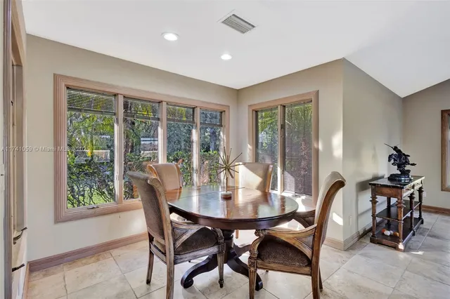 a view of a livingroom with workspace and a window
