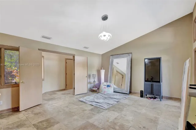 a view of a swimming pool with a lounge chair