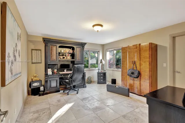 an aerial view of a houses with a lake