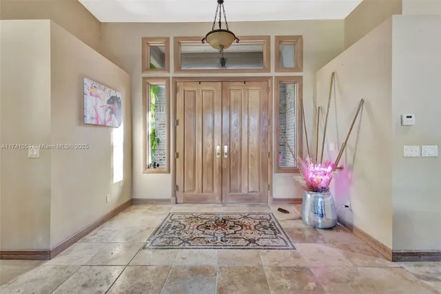 a en suite bathroom with a double vanity sink a mirror and shower