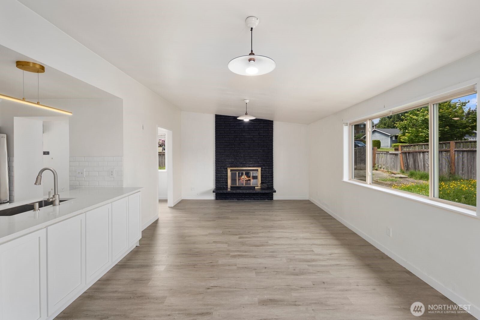 101 161st Street Southeast Bothell, WA 98012 - Photo 22 of 34 a living room with stainless steel appliances granite countertop furniture and a fireplace