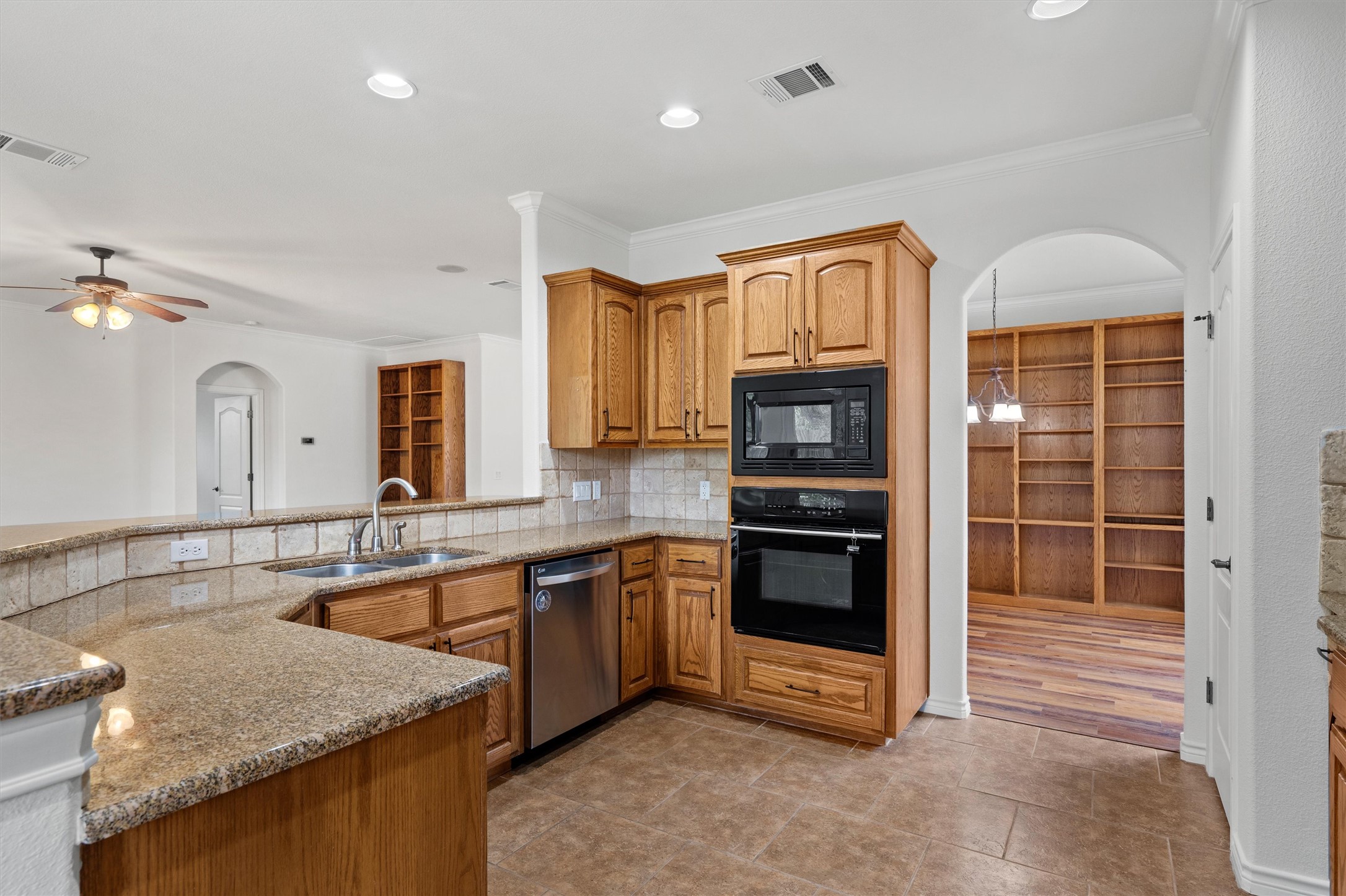 4612 Sonora Trace Georgetown, TX 78633 - Photo 22 of 36 a kitchen with stainless steel appliances granite countertop a stove and a sink