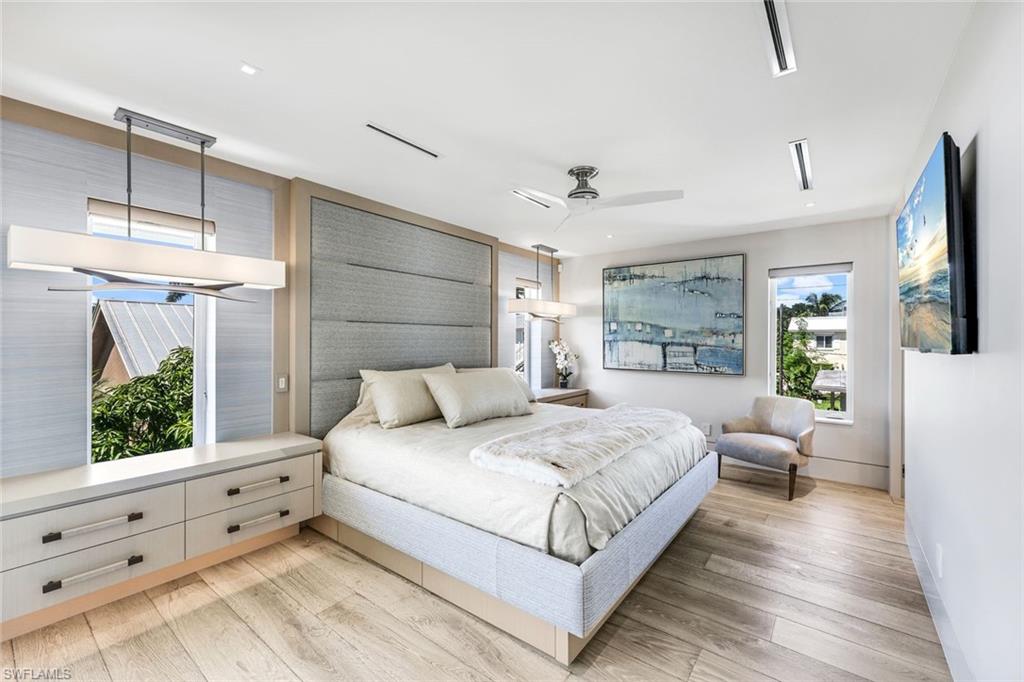 295 5th Avenue South Naples, FL 34102 - Photo 14 of 29 a bedroom with a large bed and a window