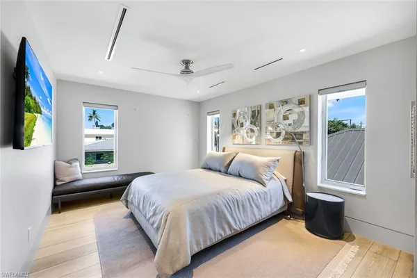 a bedroom with a large bed and a window