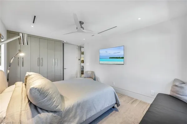 a bedroom with a bed and a lamp