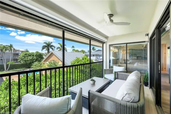 a view of a living room and a floor to ceiling window