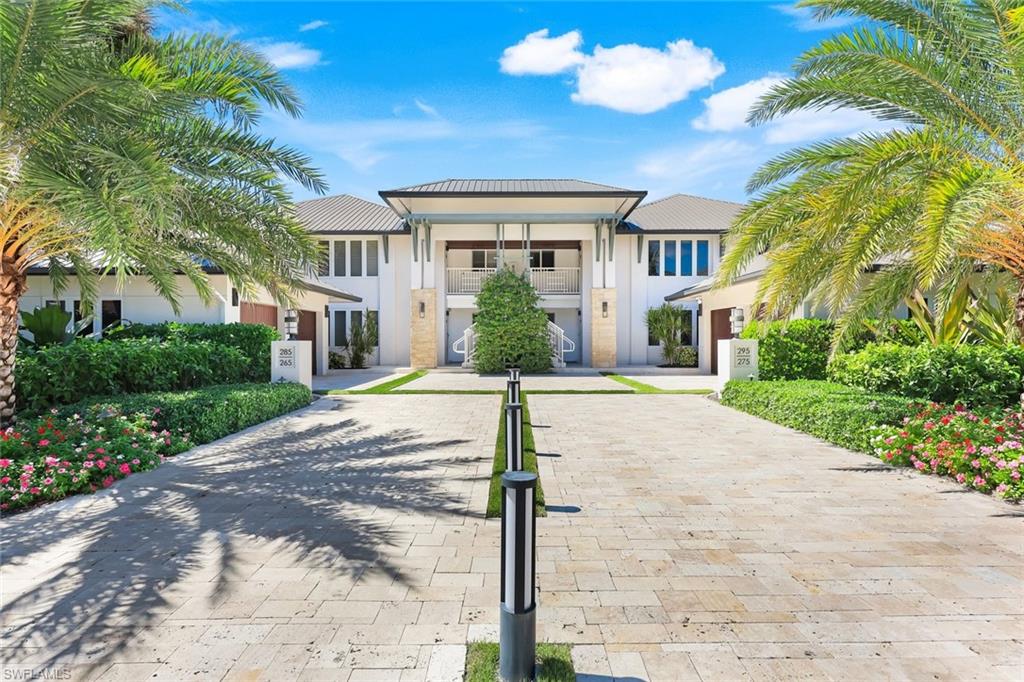 295 5th Avenue South Naples, FL 34102 - Photo 25 of 29 a front view of a house with a yard