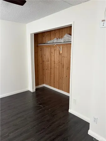 an empty room with wooden floor