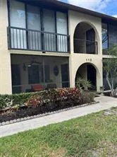 a view of house with outdoor space and swimming pool