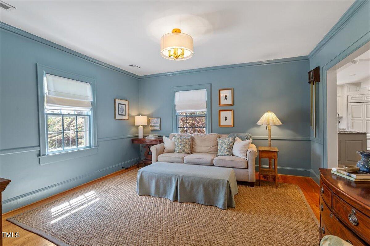 5212 Theys Road Raleigh, NC 27606 - Photo 11 of 56 a bedroom with a bed window and dresser