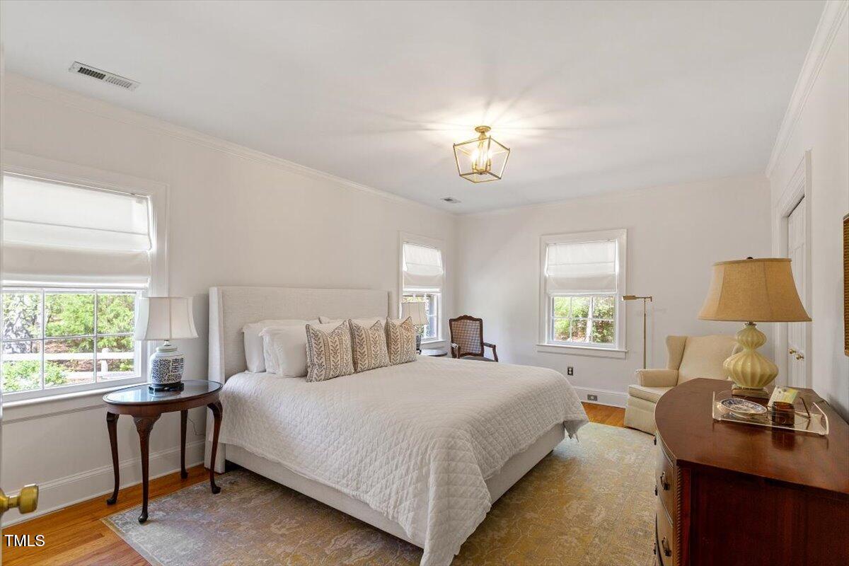 5212 Theys Road Raleigh, NC 27606 - Photo 17 of 56 a bedroom with a bed and a window