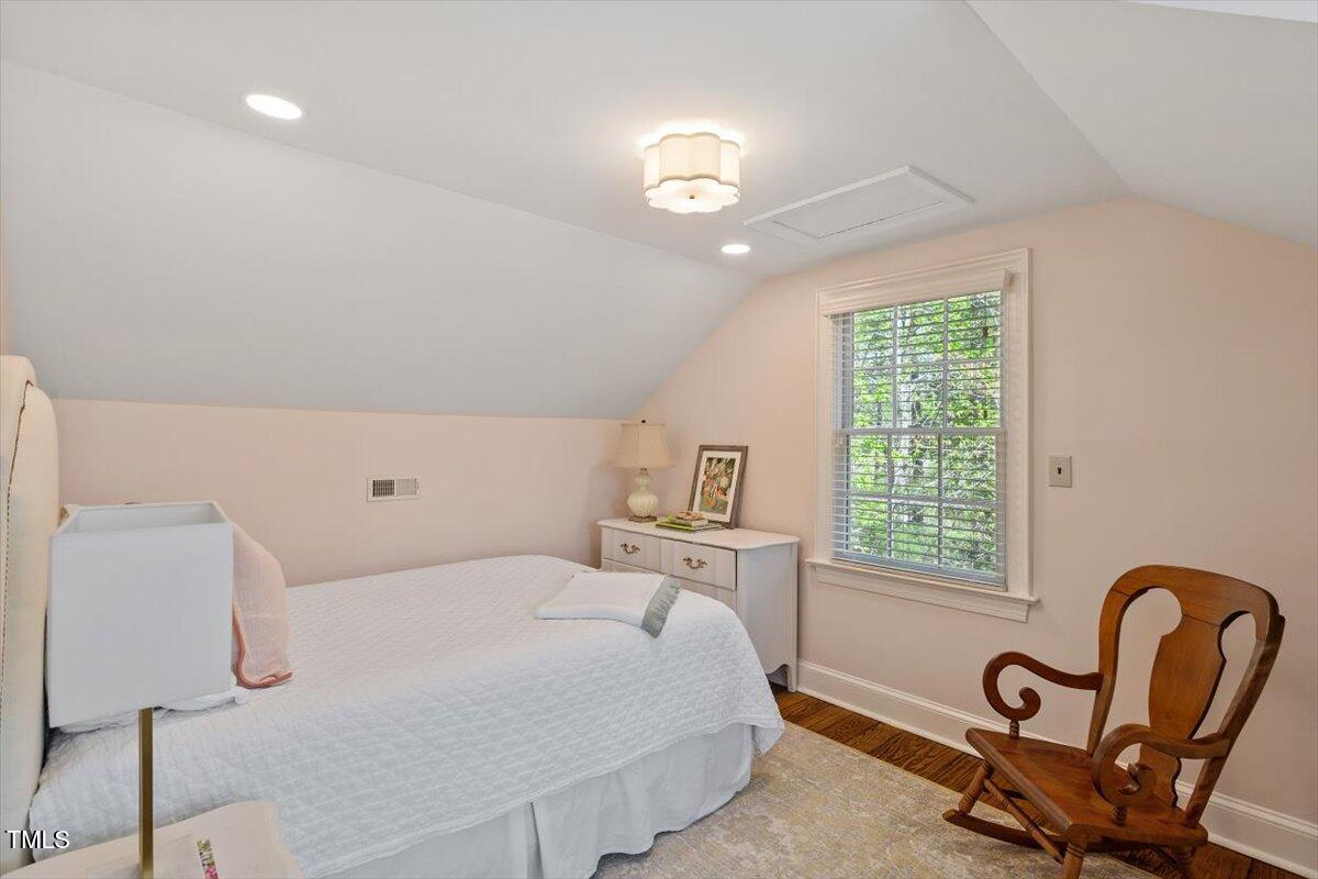 5212 Theys Road Raleigh, NC 27606 - Photo 21 of 56 a bedroom with a bed and a window