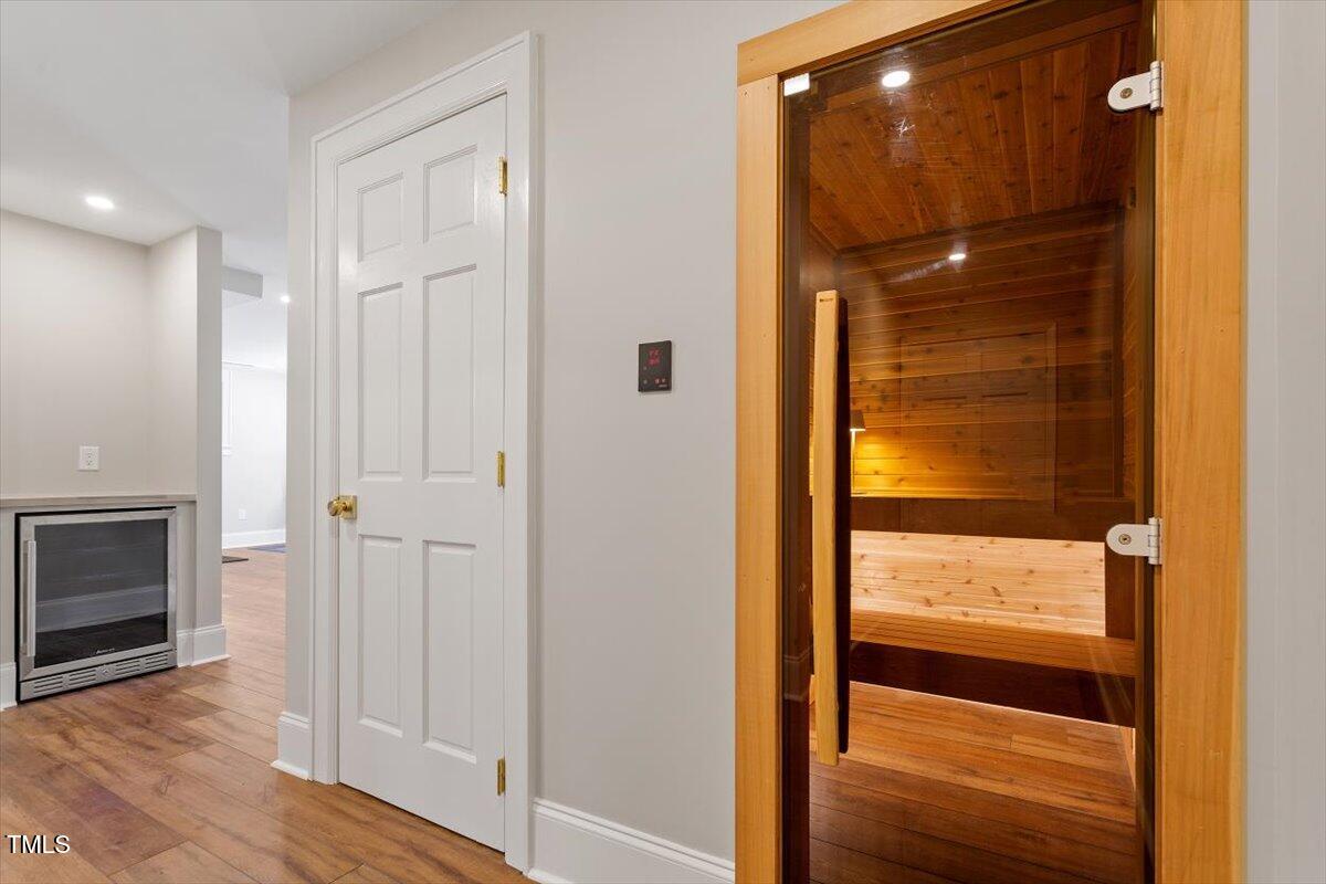 5212 Theys Road Raleigh, NC 27606 - Photo 28 of 56 a bathroom with a glass shower door and a window