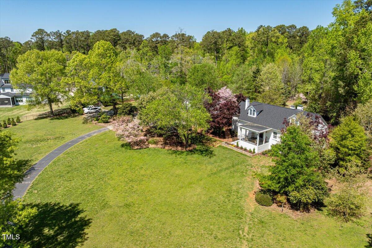 5212 Theys Road Raleigh, NC 27606 - Photo 2 of 56 a aerial view of a house with a yard basket ball court and outdoor seating