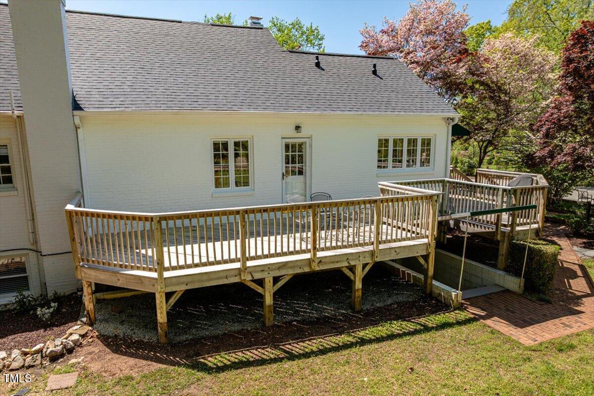 5212 Theys Road Raleigh, NC 27606 - Photo 40 of 56 a view of a house with a deck