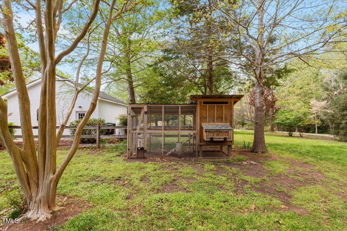 5212 Theys Road Raleigh, NC 27606 - Photo 41 of 56 front view of a house with a yard