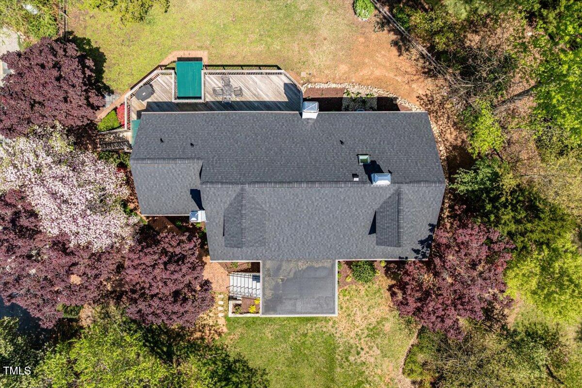 5212 Theys Road Raleigh, NC 27606 - Photo 47 of 56 an aerial view of a house with a yard and large tree