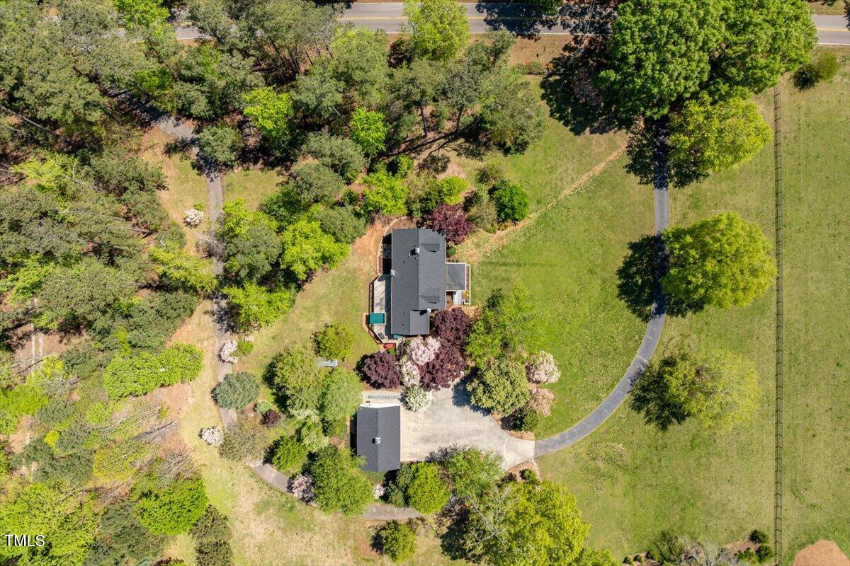 5212 Theys Road Raleigh, NC 27606 - Photo 49 of 56 an aerial view of a residential houses with yard