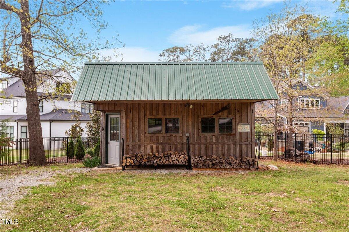 5212 Theys Road Raleigh, NC 27606 - Photo 6 of 56 a backyard of a house with barbeque oven
