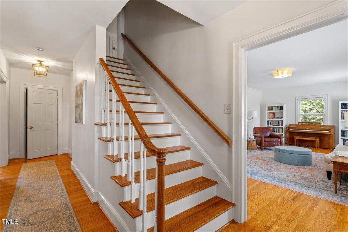 5212 Theys Road Raleigh, NC 27606 - Photo 9 of 56 a view of entryway and hall with wooden floor