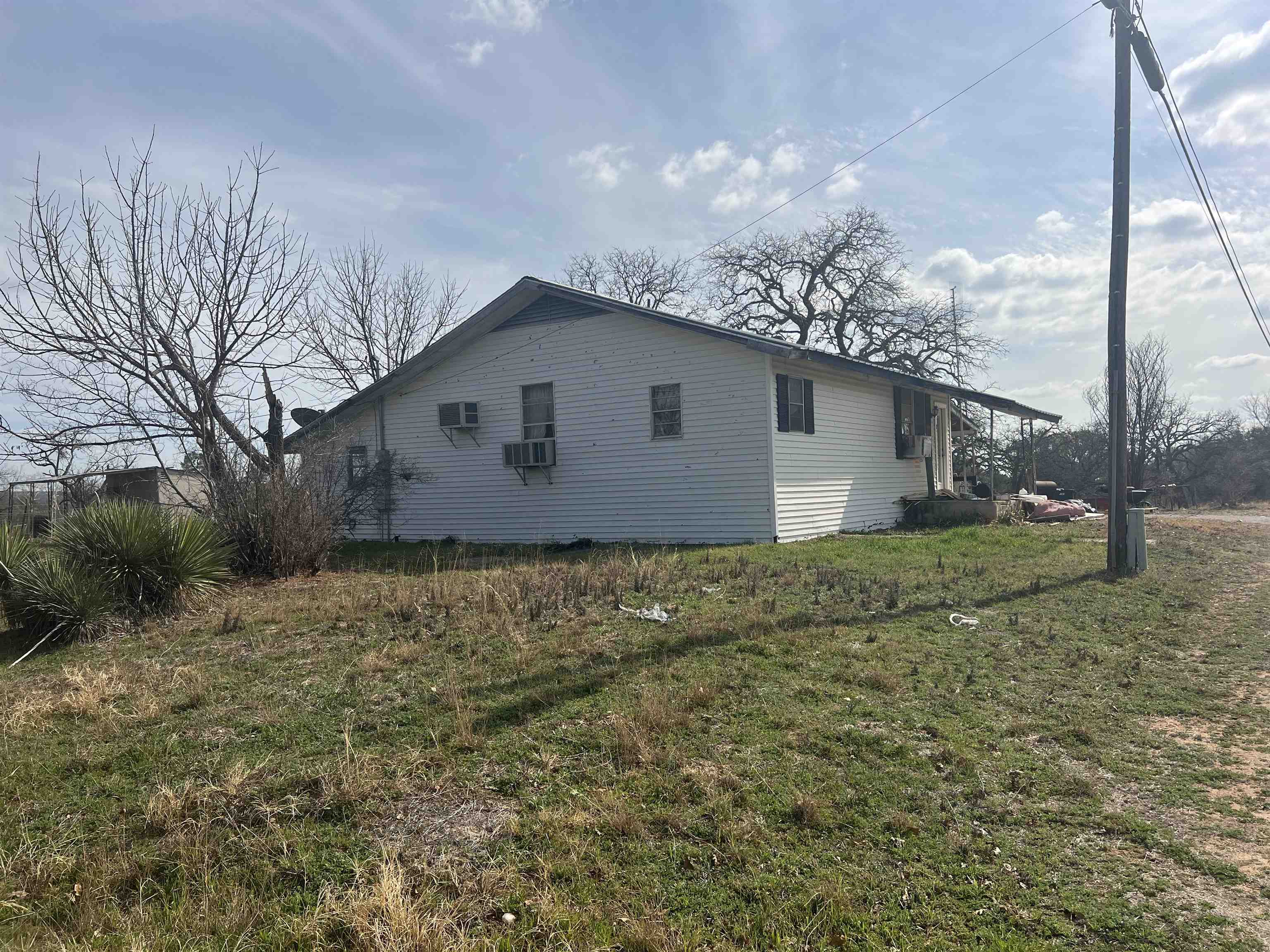 1034 Ranch Road 2545 Kingsland, TX 78639 - Photo 2 of 30 a house view with backyard space