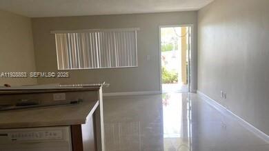 a kitchen with a sink a window and cabinets