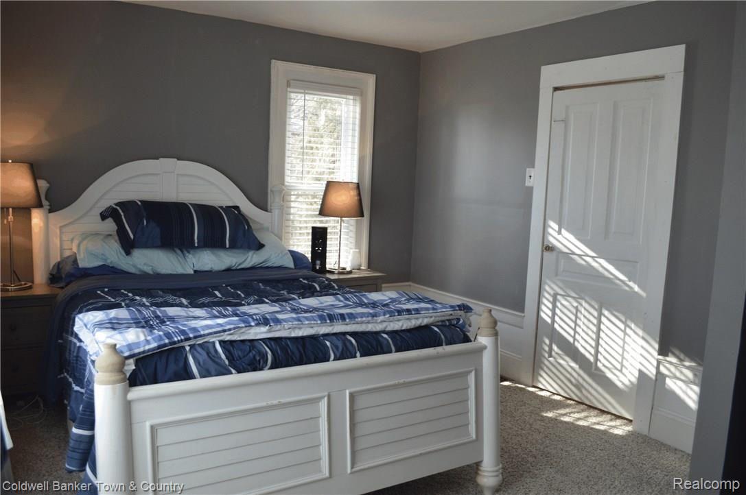 7575 North Fowlerville Road Fowlerville, MI 48836 - Photo 15 of 34 Main Floor Larger Bedroom
